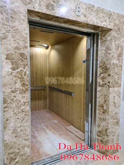 Mặt tiền thang máy ốp đá nâu tây ban nha